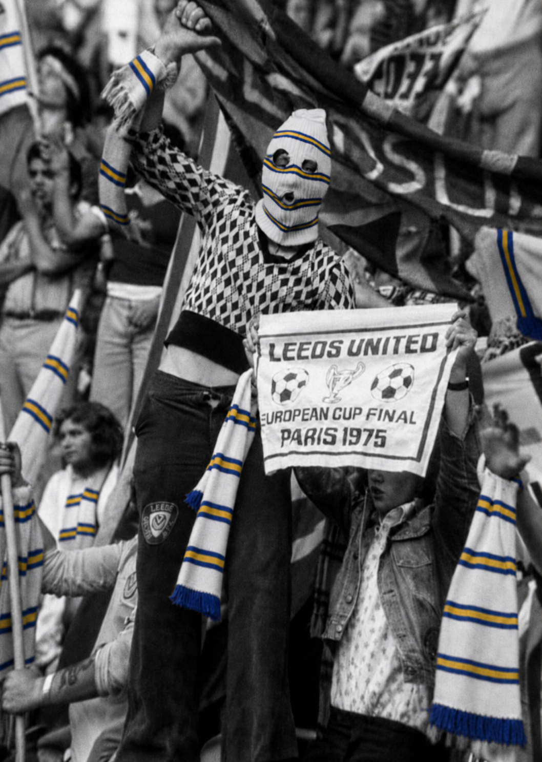 Black and white crowd scene with Leeds scarves kept in blue and yellow colour.