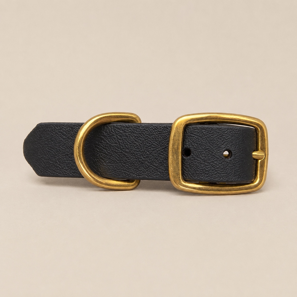 Front view of the Dirty Leeds® black made-to-measure dog collar with solid brass buckle and D-ring.