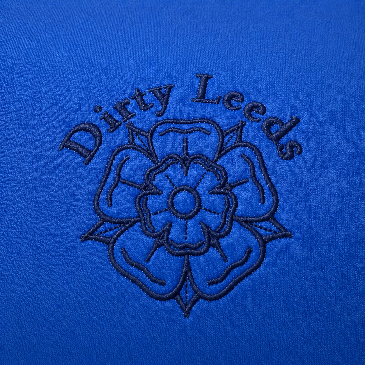 Dirty Leeds® Blue Yorkshire Rose Scuba Hoodie – front view, embroidery close-up.