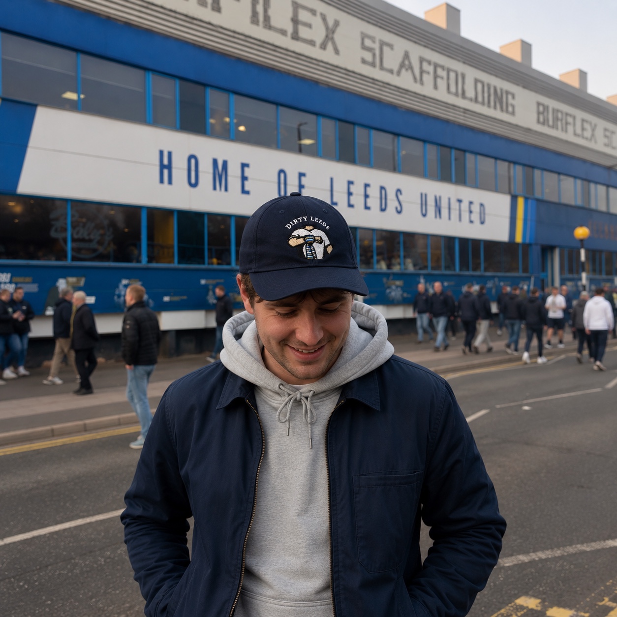 Dirty Leeds® Original Keep Fighting Salute Logo Navy Baseball Cap – Elland Road setting.