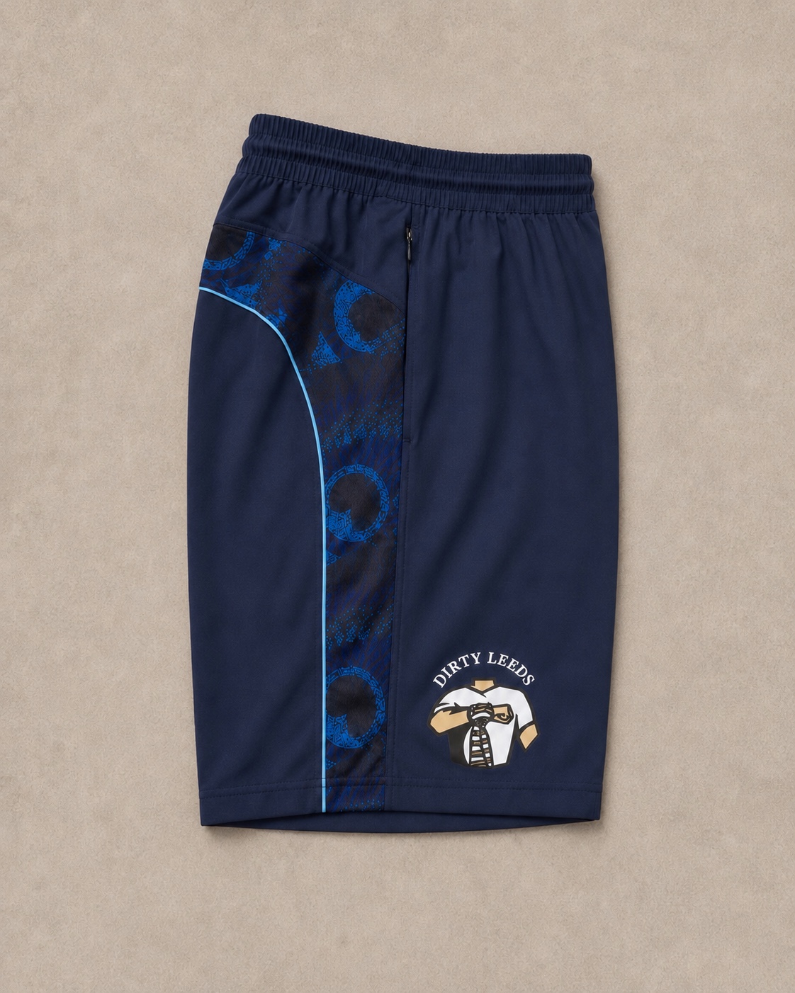 Dirty Leeds® Peacock Pattern Shorts side view with logo.