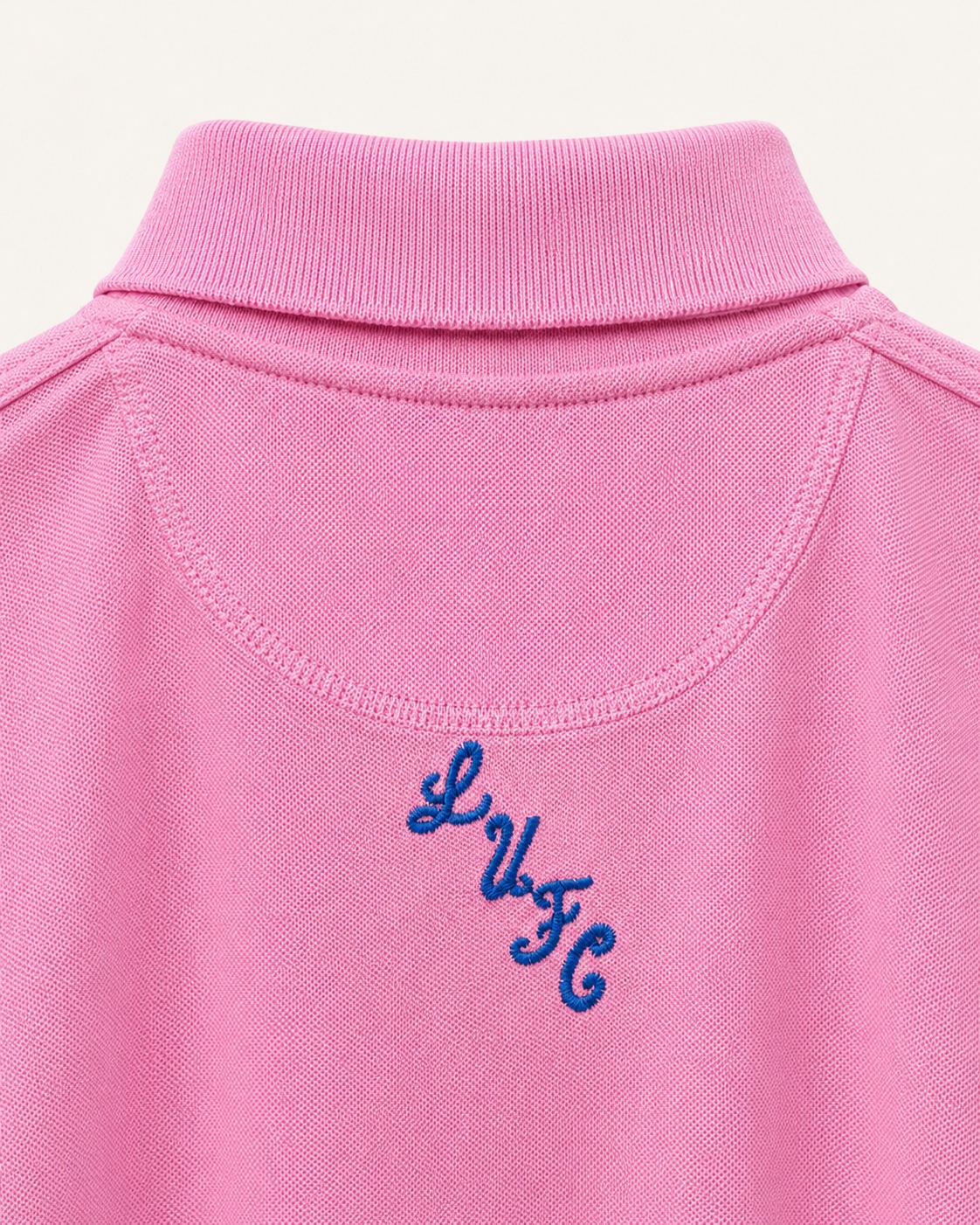 Dirty Leeds® Pink Embroidered Polo Shirt – back view, detail close-up.