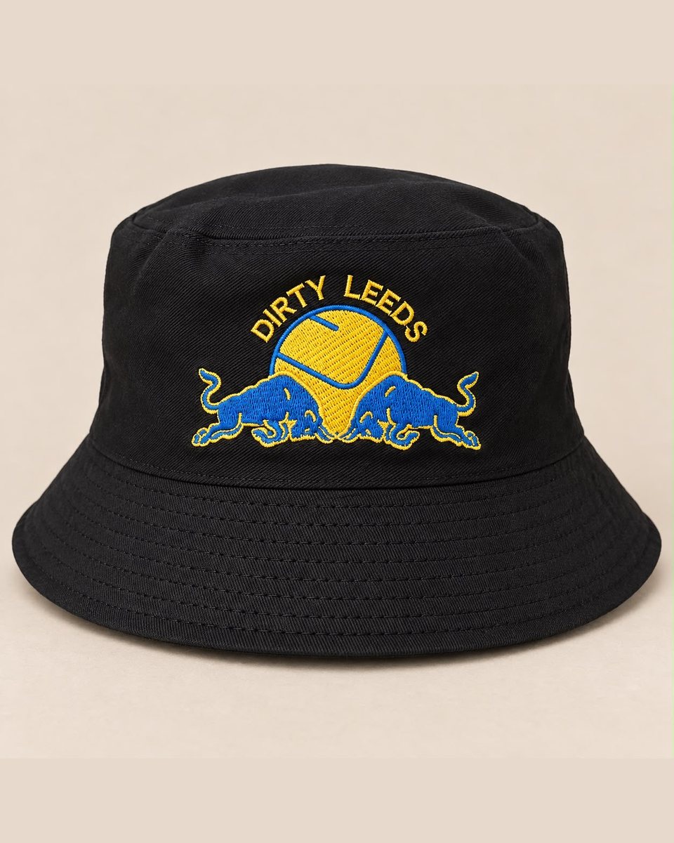 Black Dirty Leeds® bucket hat with the Leeds United smiley and Red Bull badge embroidered on the front in yellow and blue.