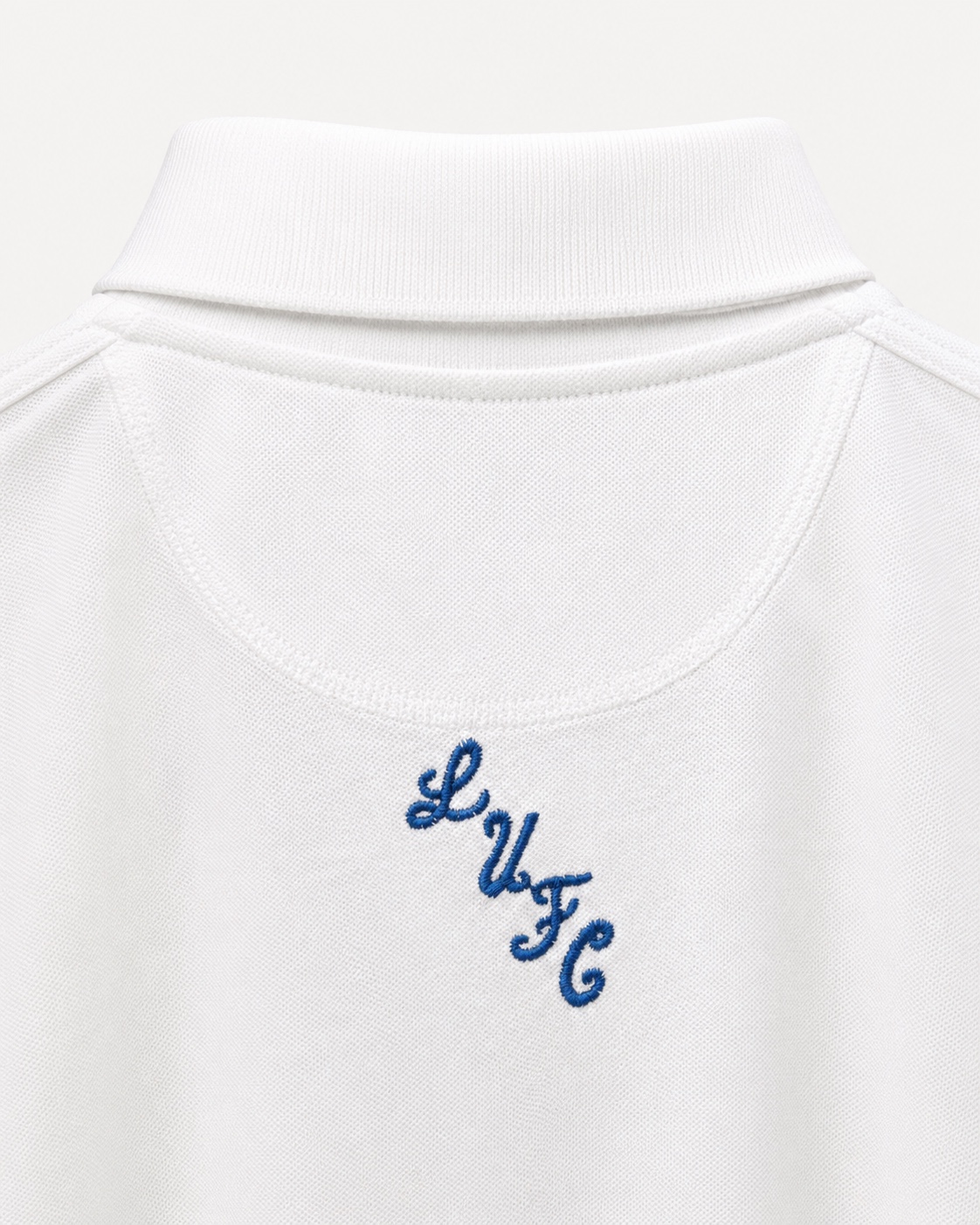 Dirty Leeds® White Embroidered Polo Shirt – back view, detail close-up.