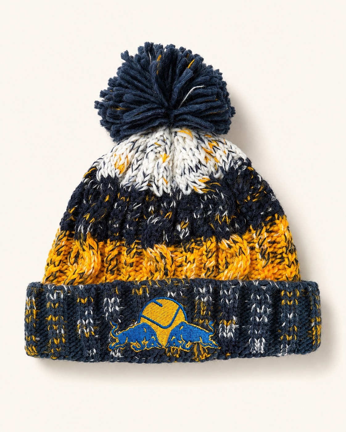 Dirty Leeds® speckled bobble hat front view with embroidered smiley badge and Red Bull, the two charging bulls, on the cuff